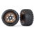 Traxxas Tires & wheels, assembled, glued (black, orange beadlock style wheels, Maxx® MT tires, foam inserts) (2) (17mm splined) (TSM® rated)